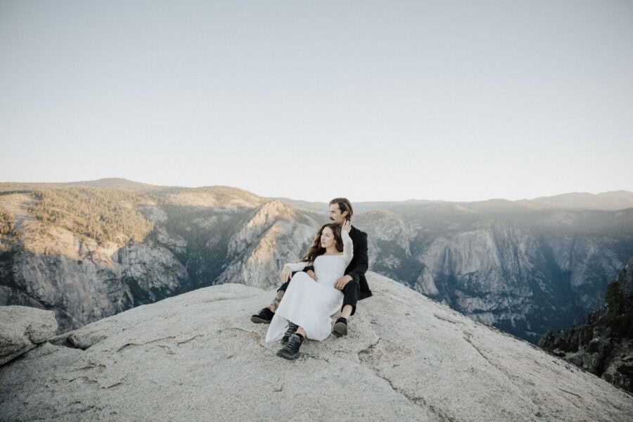 Bride and groom sharing a first moments under the glow of the sunrise in Yosemite National Park