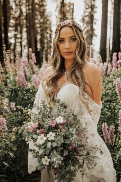 bride in field of wildflowers in Yosemite national park