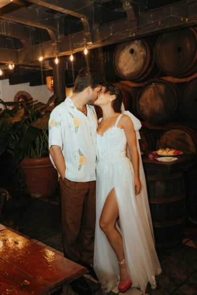 Man and Woman standing together after getting married, kissing