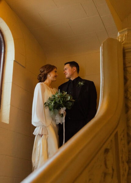 Couple looking at each other in an antique venue in Old San Juan after getting married