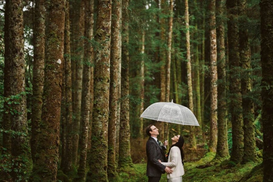 Couple eloping in the woods in Ireland in the rain
